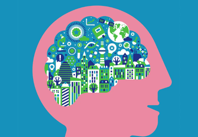 A clipart image of a human head with a cutaway in the brain revealing a city scape full of ideas